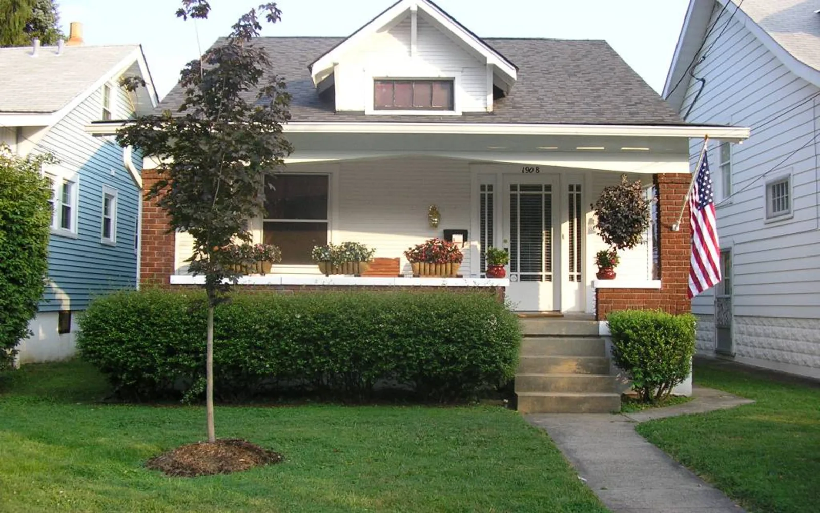 A traditional bungalow-style single-family home with front yard, typical of residential neighborhoods in mid-sized communities